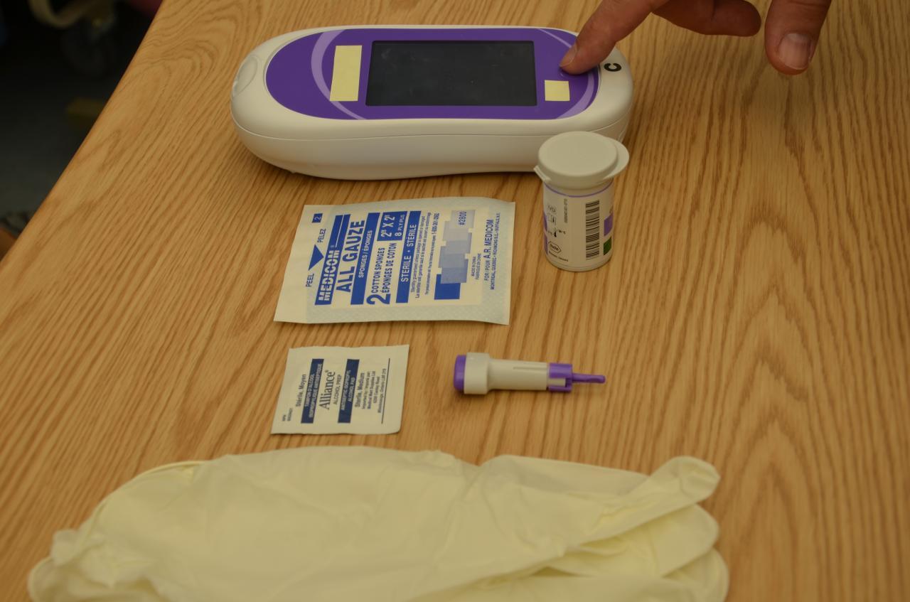 Focused man unpacking carton box in room · Free Stock Photo